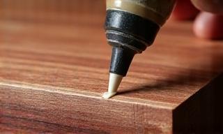 Applying wood glue to a joint